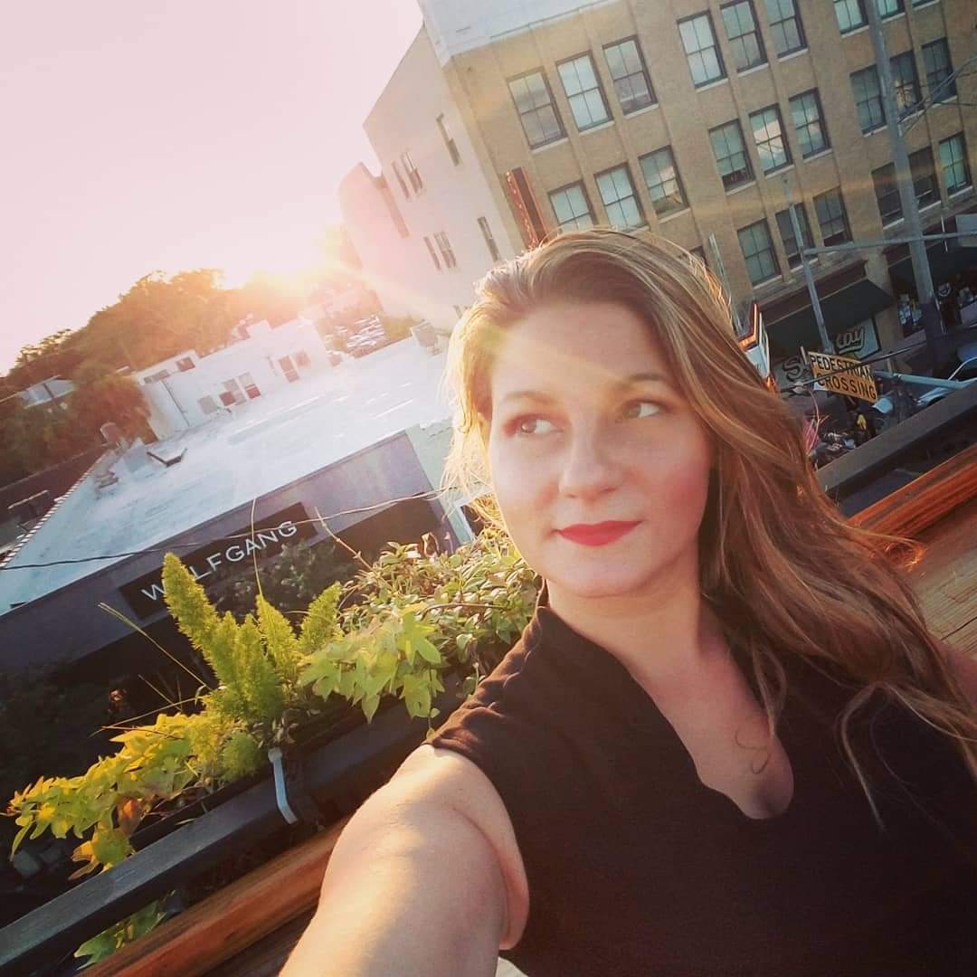 Liza White in a city setting at sunset